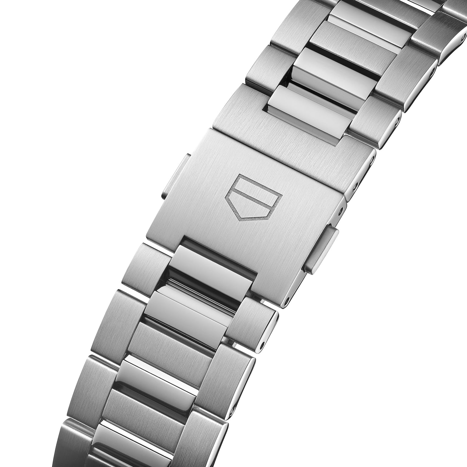 Close-up of a TAG Heuer Carrera Day-Date’s stainless steel bracelet with brushed clasp and engraved shield, showcased with a black azurage dial and calibre 5 automatic movement.