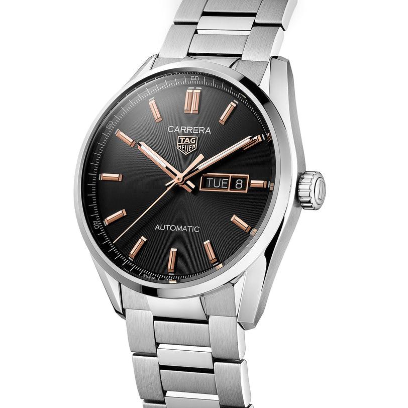 The TAG Heuer Carrera Day-Date wristwatch features a black dial, gold-tone markers, day-date display, stainless steel bracelet, and Calibre 5 automatic movement for lasting style.