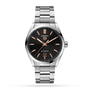 The TAG Heuer Carrera Date features a stainless steel case, black dial with gold hour markers and hands, date display at 6 o’clock, Calibre 5 movement, and a metal bracelet.