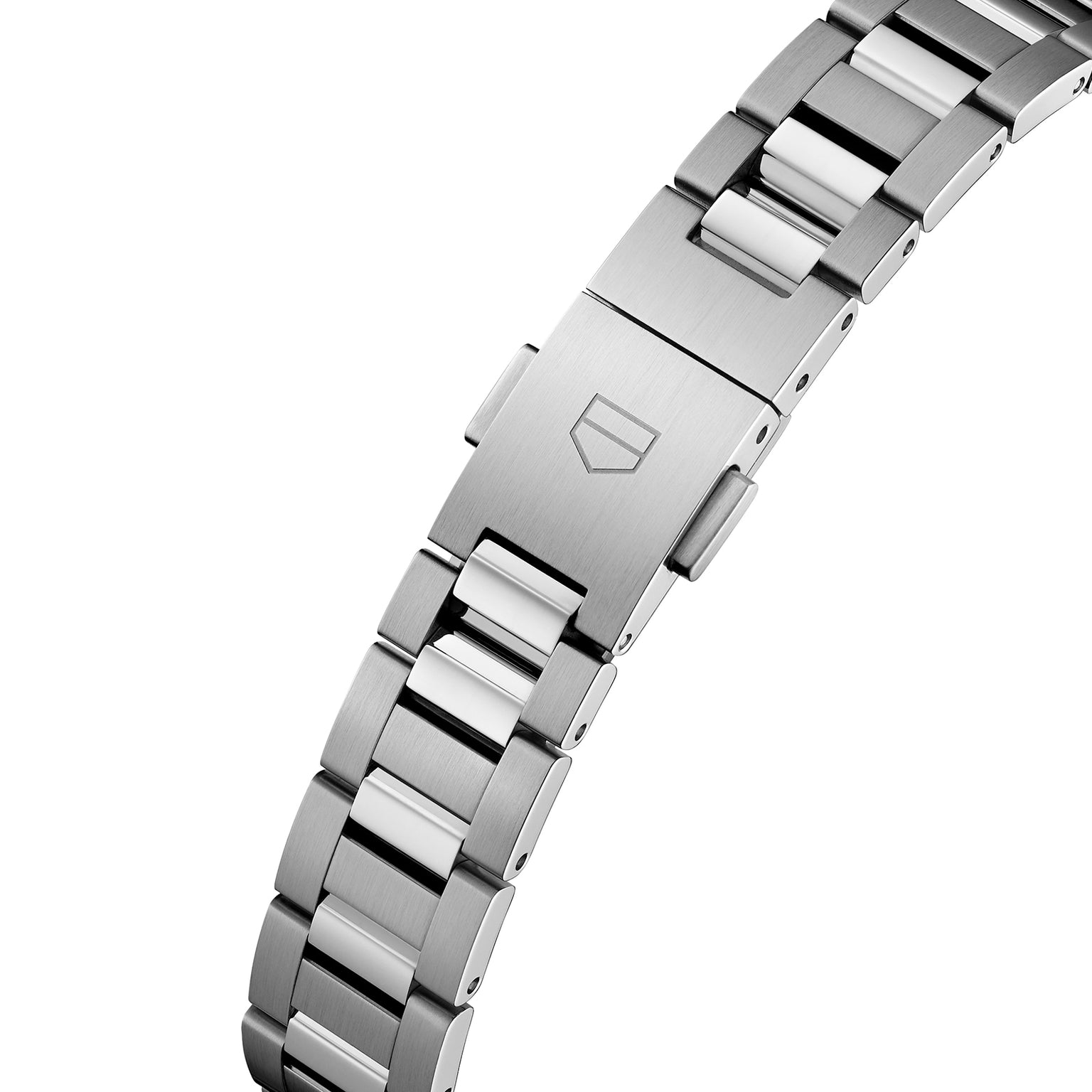 A close-up of the TAG Heuer Carrera Dates stainless steel bracelet, showcasing a clasp engraved with the signature shield logo.