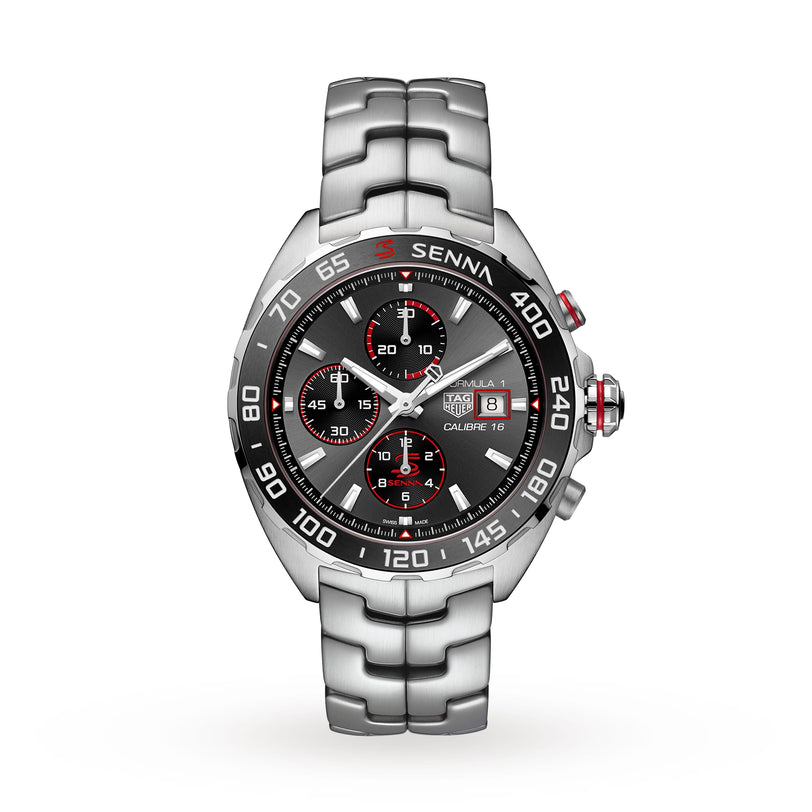 The TAG Heuer Special Edition Formula 1 Senna is a silver chronograph with a black bezel, three subdials, date display, metal bracelet, and Ayrton Senna branding on the dial.