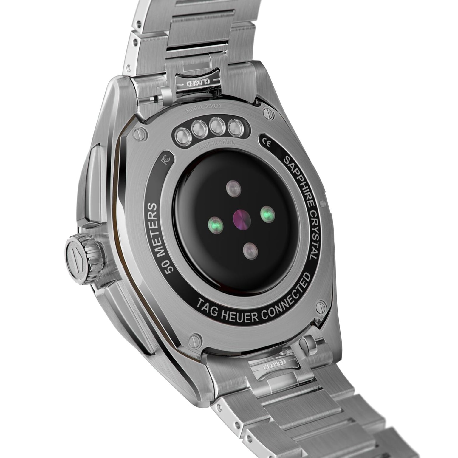 Close-up of the TAG Heuer Connected Calibre E4 smartwatchs back, highlighting its sensors, sapphire crystal marking, and stainless steel bracelet.