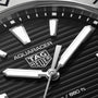 Close-up of a TAG Heuer Aquaracer Professional 200 watch face featuring silver hands and markers on a black textured dial.