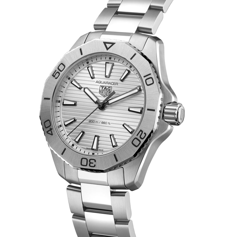 The TAG Heuer Aquaracer Professional 200 is a silver wristwatch with stainless steel case and band, unidirectional bezel, silver dial with logo, quartz movement, and 300m/1000ft water resistance.