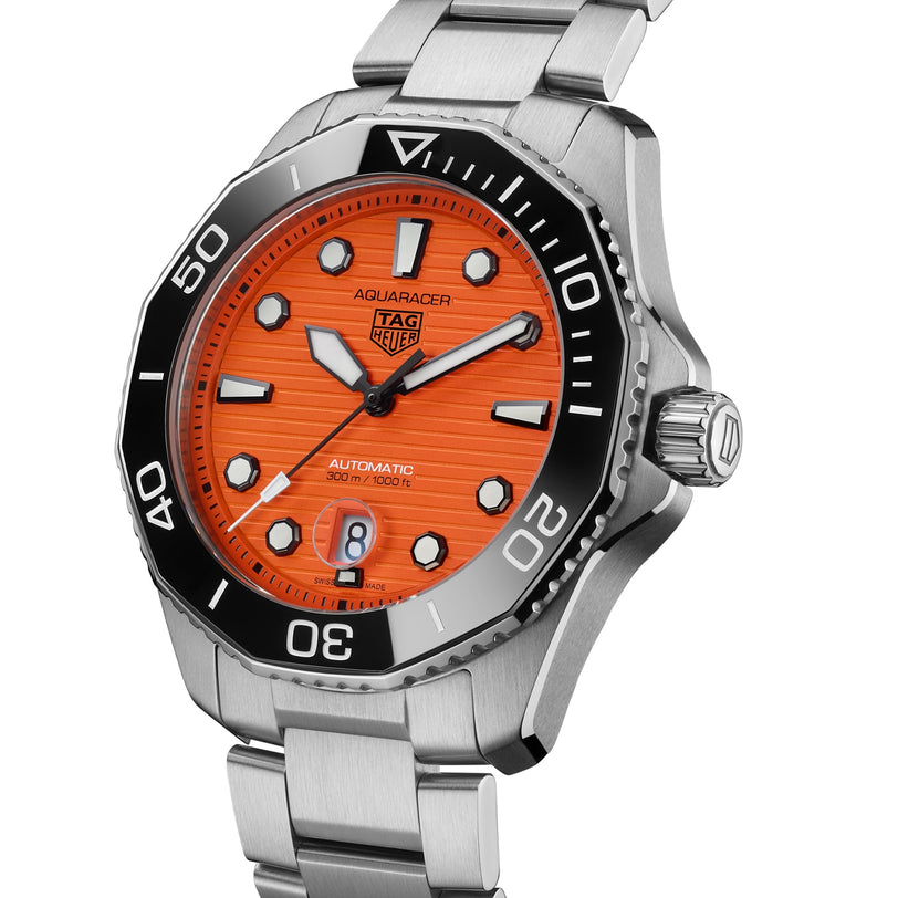 Close-up of the TAG Heuer Aquaracer Professional 300 Orange Diver featuring an orange dial, silver band, and black bezel.