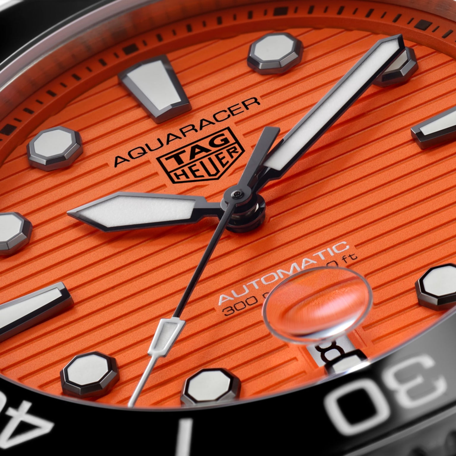 Close-up of the TAG Heuer Aquaracer Professional 300 Orange Diver, featuring an orange dial with bold markers and hands in a 43mm stainless steel case, displaying Automatic 300m/1000ft.