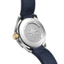 Close-up of the back of a TAG Heuer Aquaracer Professional 200 Date watch, featuring a compass engraving, gold crown, and blue rubber strap; this Swiss-made watch is water-resistant up to 200 meters.