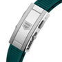 Close-up of a TAG Heuer Aquaracer Professional 300 Date silver clasp with a geometric logo, attached to a green textured rubber strap—an ideal match for this iconic diving watch’s style.