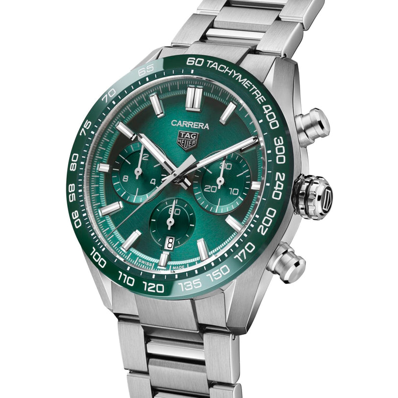 The TAG Heuer Carrera Chronograph features a stainless steel case, green dial with silver markers, three subdials, tachymeter bezel, and is powered by the Heuer 02 calibre—honoring the motor-racing legacy of Carrera.