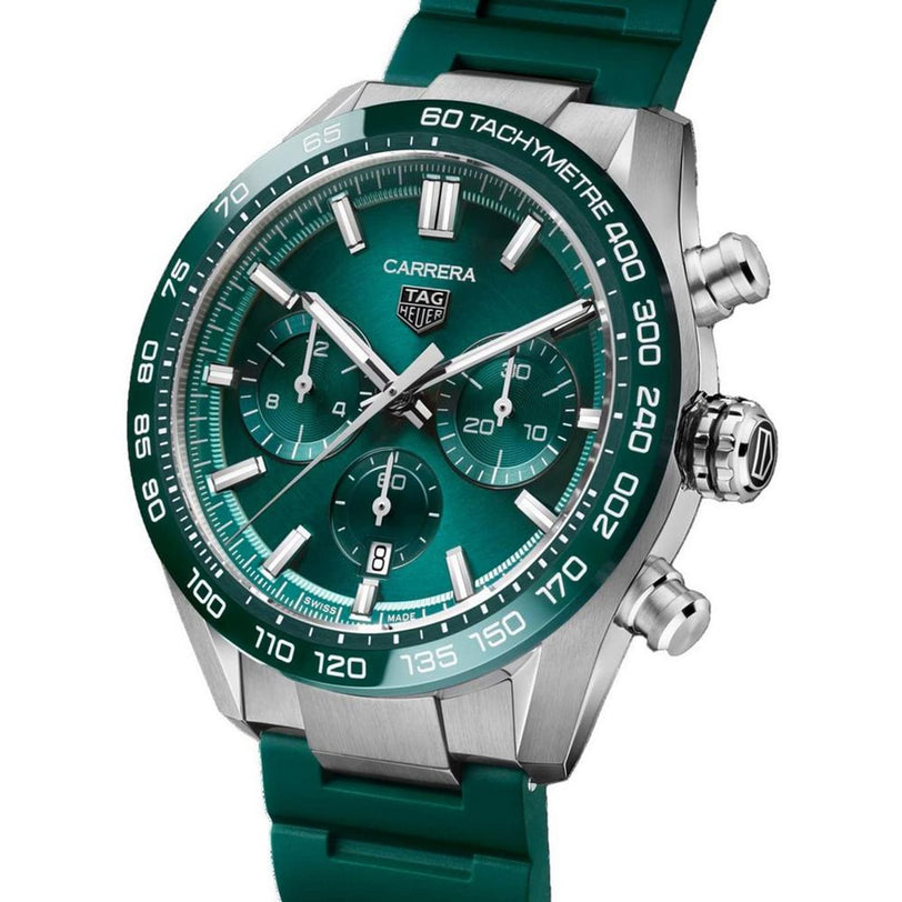 The TAG Heuer Carrera Chronograph features a green dial with three subdials, silver hour markers, and a green rubber strap—powered by the Heuer 02 calibre and inspired by TAG Heuer’s racing heritage.