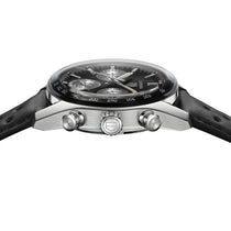 A close-up side view of the TAG Heuer Carrera Chronograph, featuring an analog display, black leather strap, silver accents, two side push buttons, and automatic movement.