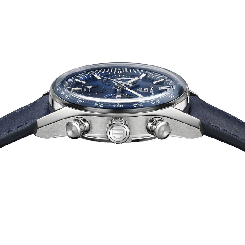 A close-up side view of the TAG Heuer Carrera Chronograph, featuring a blue leather strap, blue dial, Calibre TH20-00 movement, and three control buttons on the side.