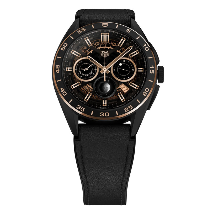 The TAG Heuer Limited Edition Connected Calibre E4 Bright Black Edition features a skeleton dial, rose gold accents, two subdials, and a black leather strap, displayed on a white background.