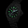 The TAG Heuer Aquaracer Professional 200 Solargraph features a black case, glowing green dial and markers, and a date at 3 o’clock. This solar-powered watch stands out against a black background, blending bold style with innovation.