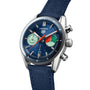 The TAG Heuer Carrera Chronograph Skipper is a blue wristwatch with a textured strap, inspired by the Carrera Panamericana race, featuring two subdials (green and white with red), a date window at 6 o’clock, and TH20-06 calibre.