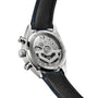 The Carrera Chronograph Skipper by TAG Heuer features a back view with an exposed automatic movement, visible inscriptions, and a black leather strap accented with blue stitching.