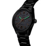 The TAG Heuer Carrera Date is a black wristwatch with a steel case, textured dial, bronze hour markers, date display, and luminescent hands, shown on a matching black metal bracelet.