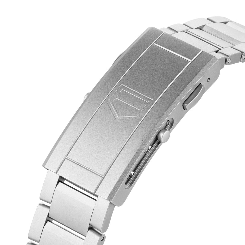 Close-up of the TAG Heuer Limited Edition 1 of 500 Aquaracer Professional 300’s stainless steel bracelet clasp, highlighting its geometric logo engraving and push buttons—a testament to the precision of this luxury timepiece.