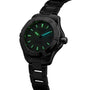A TAG Heuer Aquaracer 200 Professional Solargraph wristwatch in black metal with a glowing green dial and markers, date display at 3 o’clock, photographed on a white background.