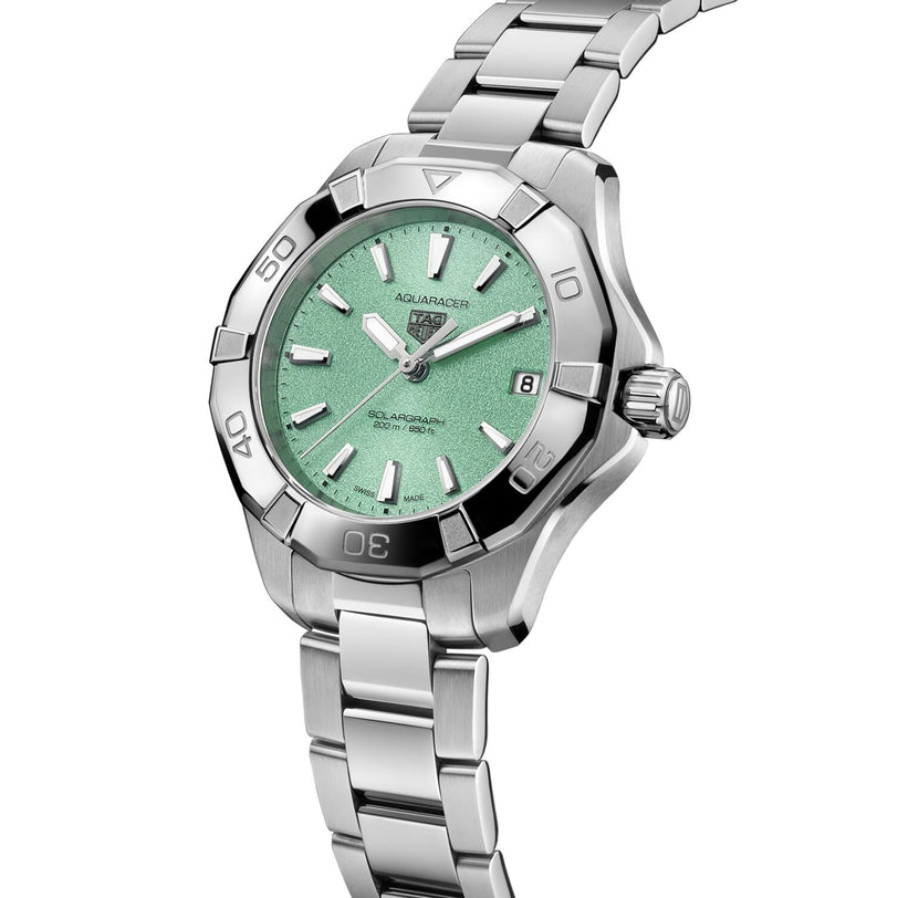 The TAG Heuer Aquaracer 200 Professional Solargraph features a mint green Northern Lights-inspired dial, date at 3 oclock, and a stainless steel bracelet.