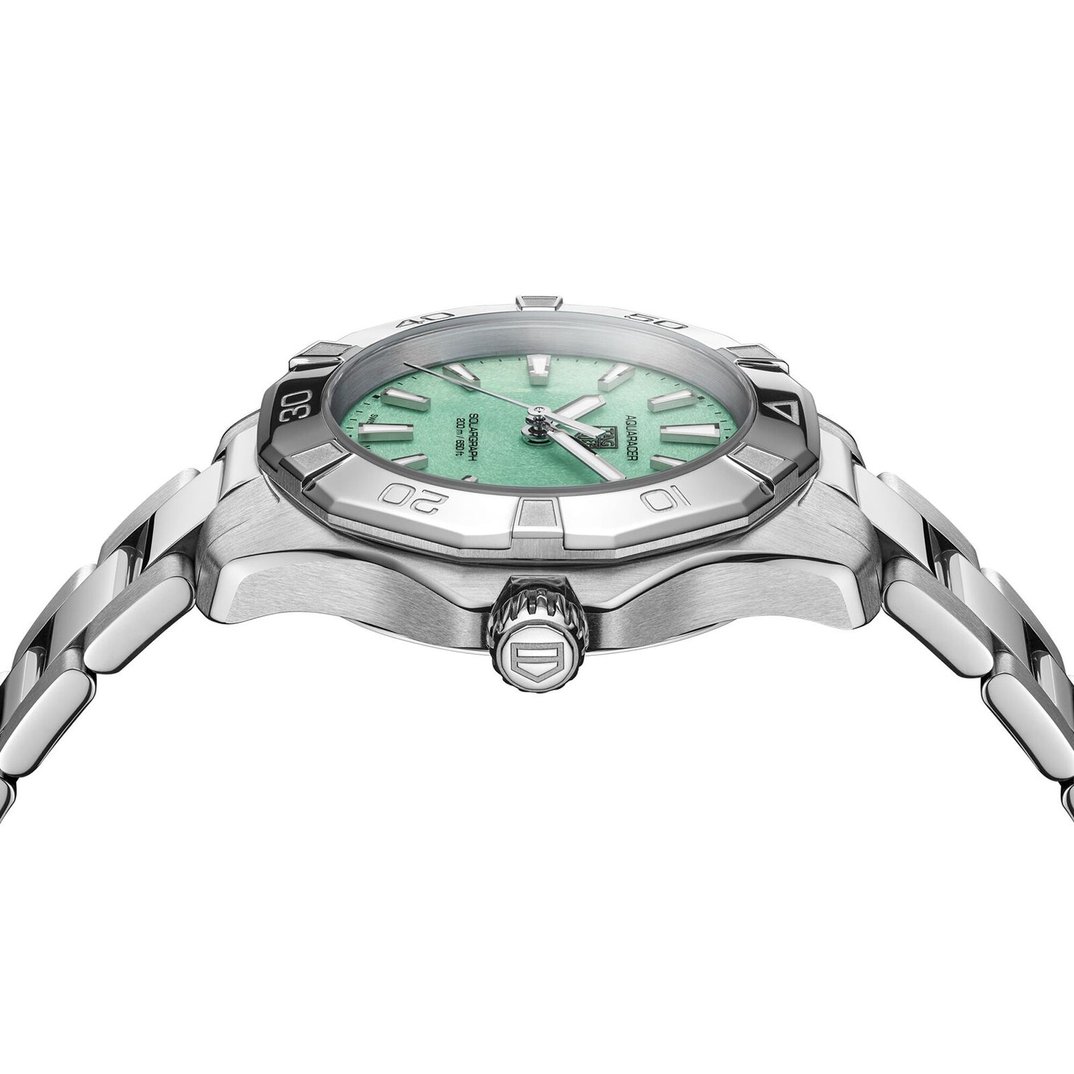Side view of the TAG Heuer Aquaracer 200 Professional Solargraph, a stainless steel watch with a mint green dial, silver indices, and metal bracelet. The right-side crown and case reflect subtle Northern Lights-inspired hues.