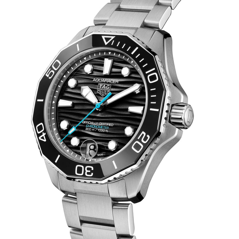 The TAG Heuer Aquaracer Professional 300 Date is a stainless steel watch featuring a black dial, silver hour markers, blue second hand, and a unidirectional bezel—a striking choice in luxury timepieces.