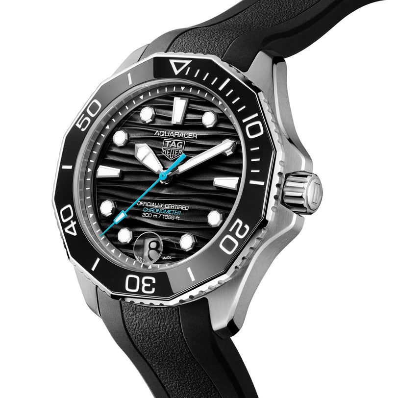 The TAG Heuer Aquaracer Professional 300 Date features a black dial, silver hour markers, and a black rubber strap—an iconic timepiece for luxury watch enthusiasts.