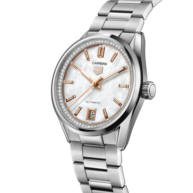 The TAG Heuer Carrera Date wristwatch from the Carrera collection features a silver stainless steel bracelet, white dial, gold hour markers, automatic movement, and a date window at 6 o’clock.