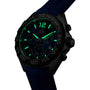 The TAG Heuer Formula 1 Chronograph showcases a dynamic design with a blue strap and luminous green hands and numerals, all set against a sleek dark background.