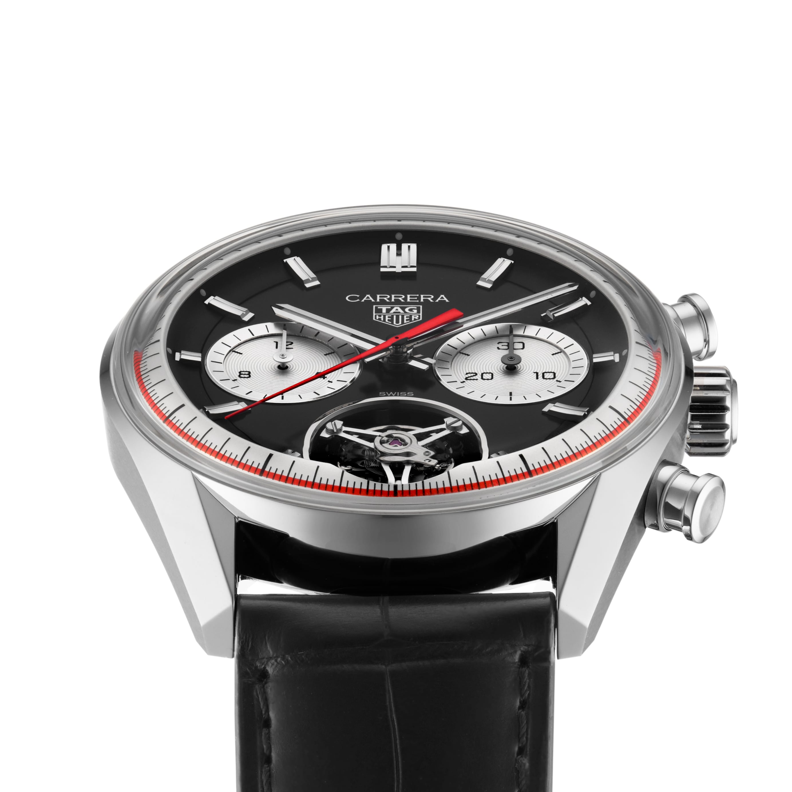 The TAG Heuer Carrera Tourbillon Centenary The Watches of Switzerland Group Exclusive features a black dial, two subdials, red accents, and a black leather strap, presented at an angle.