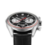 The TAG Heuer Carrera Tourbillon Centenary The Watches of Switzerland Group Exclusive features a black dial, two subdials, red accents, and a black leather strap, presented at an angle.