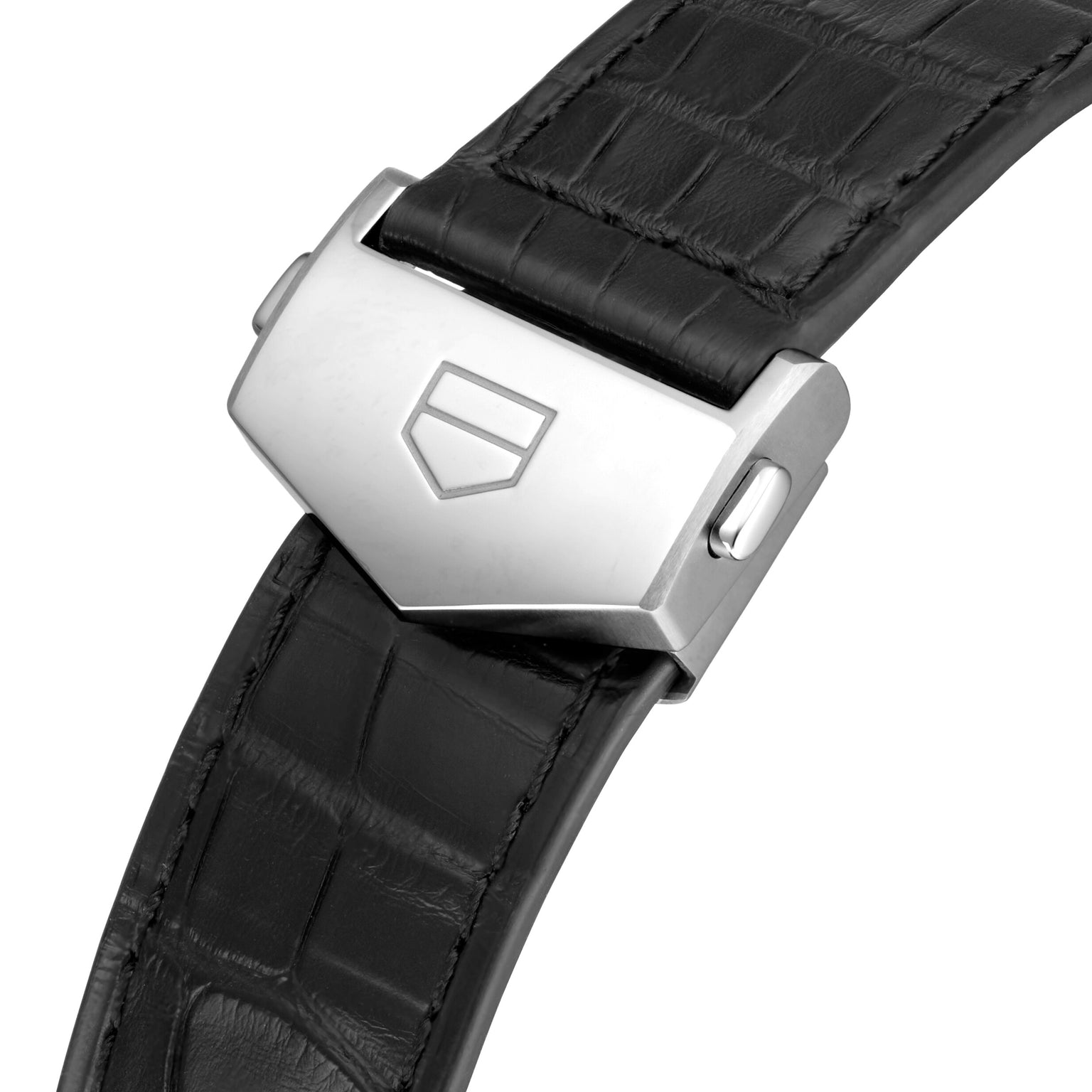 A close-up of a black leather TAG Heuer strap with a silver clasp engraved with the geometric shield logo, inspired by the Carrera Tourbillon Centenary The Watches of Switzerland Group Exclusive.