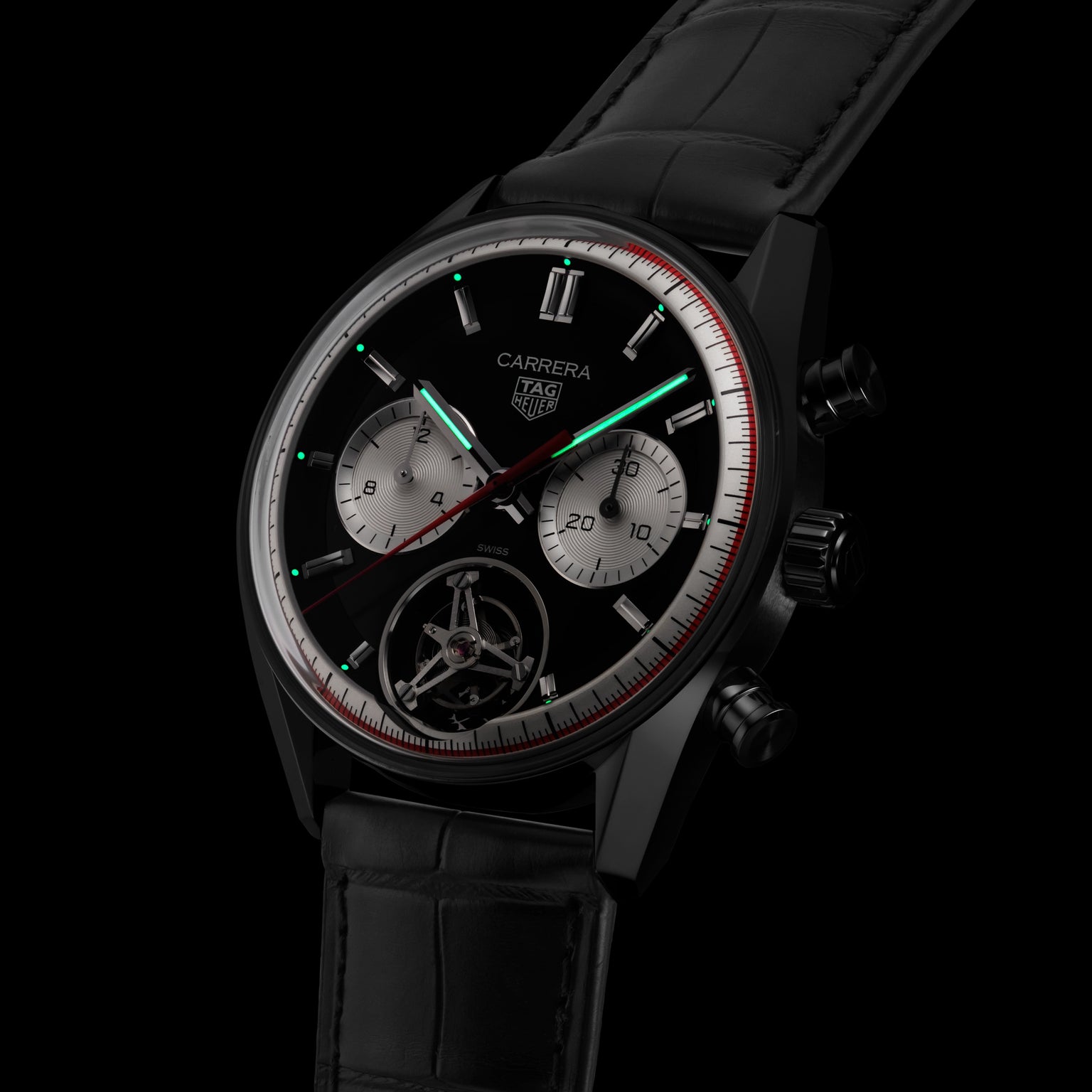The TAG Heuer Carrera Tourbillon Centenary The Watches of Switzerland Group Exclusive features a black dial, silver subdials, red accents, visible tourbillon, and a leather strap.