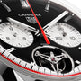 Close-up of the TAG Heuer Carrera Tourbillon Centenary The Watches of Switzerland Group Exclusive, showcasing the brand logo, chronograph dials, red seconds hand, and exposed tourbillon mechanism.