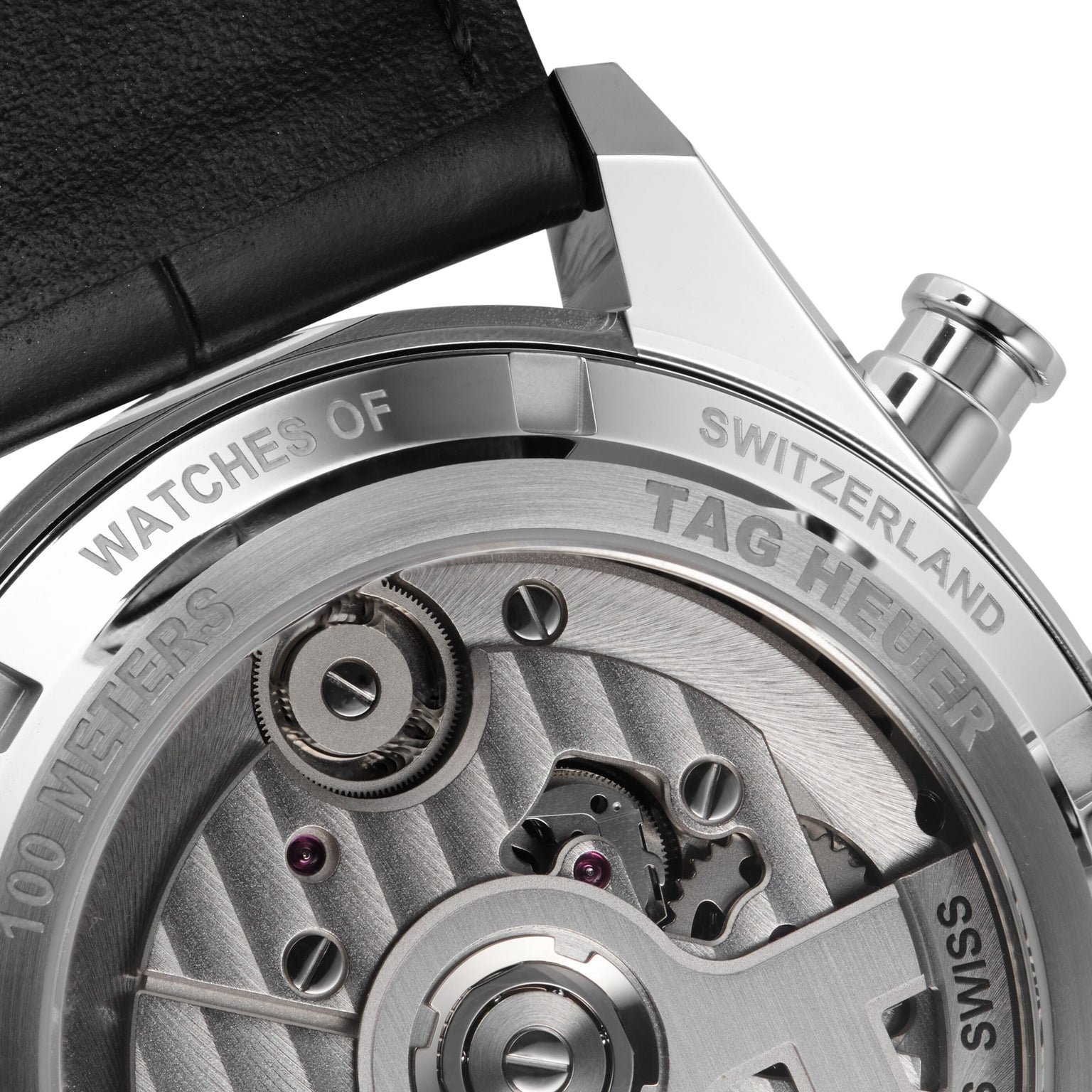 Close-up of the back of the TAG Heuer Carrera Tourbillon Centenary The Watches of Switzerland Group Exclusive, highlighting engraved branding and part of the visible mechanical movement.