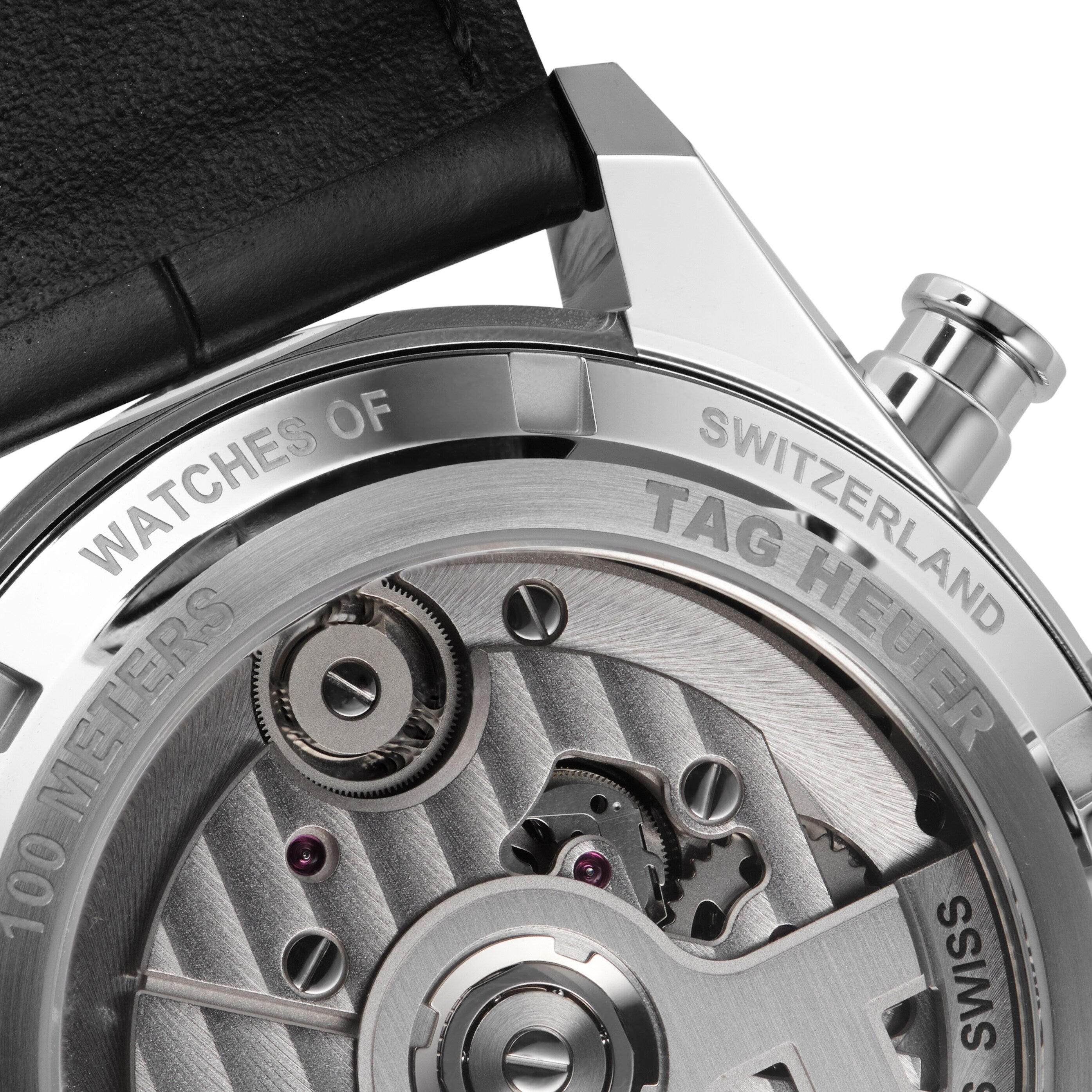 Close-up of the back of the TAG Heuer Carrera Tourbillon Centenary The Watches of Switzerland Group Exclusive, highlighting engraved branding and part of the visible mechanical movement.