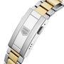 Close-up of a TAG Heuer Aquaracer Professional 200 Solargraph’s two-tone bracelet with silver and gold links, deployment clasp, and engraved shield logo.
