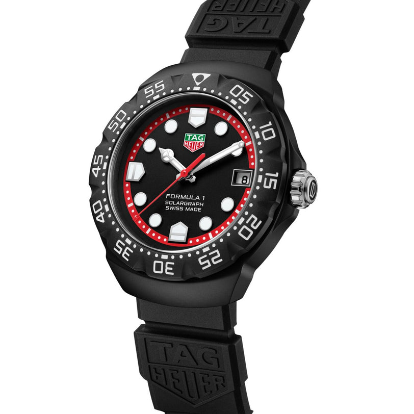 The TAG Heuer Formula 1 Solargraph watch features a black band, red accents, and bold white markers on its dial.