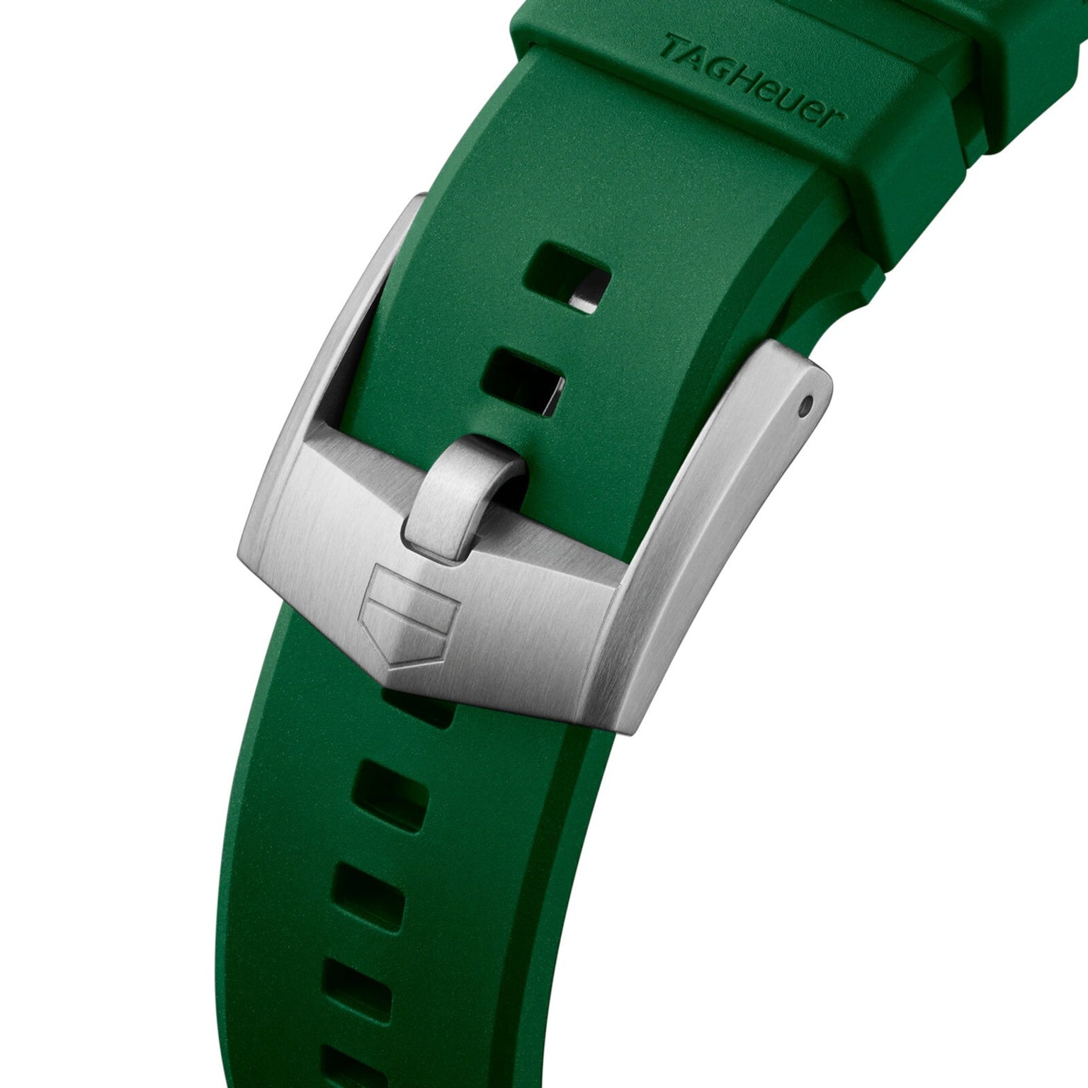 Close-up of a green TAG Heuer Formula 1 Solargraph watch strap with a silver buckle engraved with the TAG Heuer shield logo.