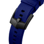 Close-up of a blue TAG Heuer Formula 1 Solargraph watch strap featuring a black buckle with the shield logo, isolated on a white background.