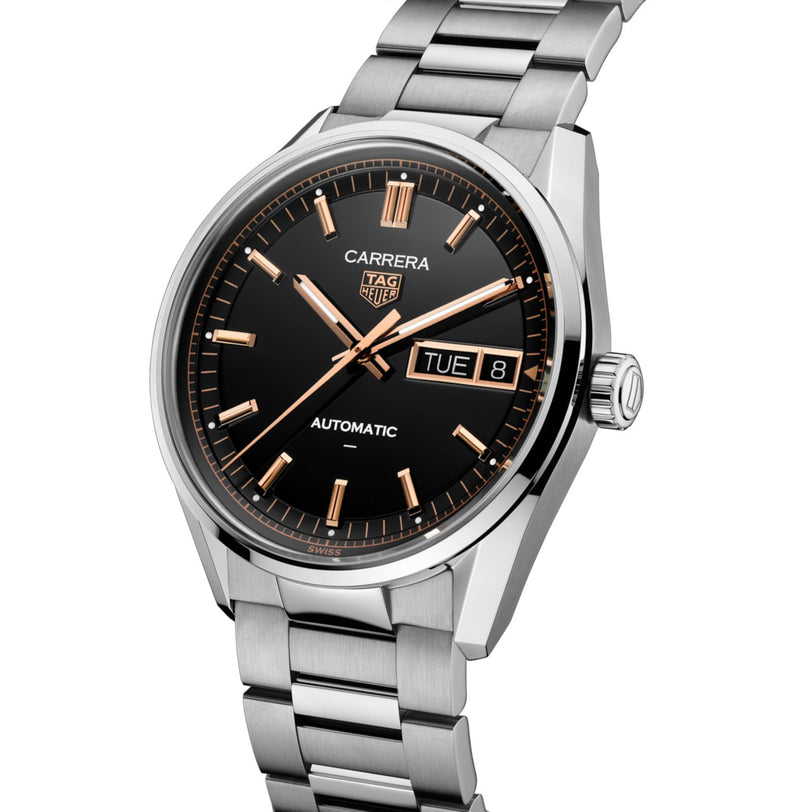The TAG Heuer Carrera Day-Date features a silver case, black dial, gold markers, day and date display, and a metal bracelet.