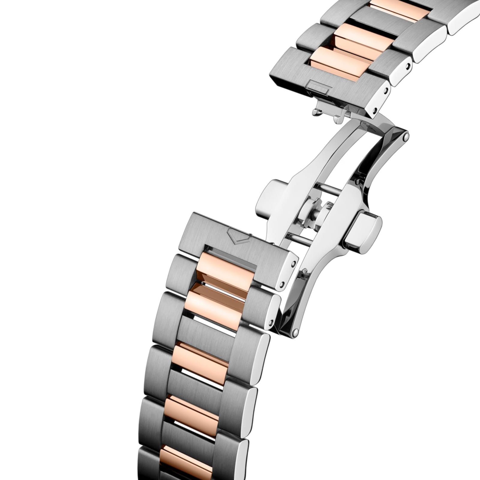 A close-up of the TAG Heuer Carrera Day-Date’s two-tone metal bracelet, showcasing silver and rose gold links with a butterfly clasp.