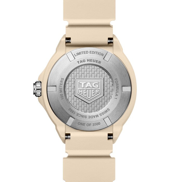 Tag Heuer watch with beige strap and silver dial on a white background