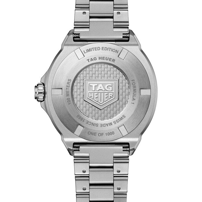 Silver TAG Heuer watch with detailed branding on a white background