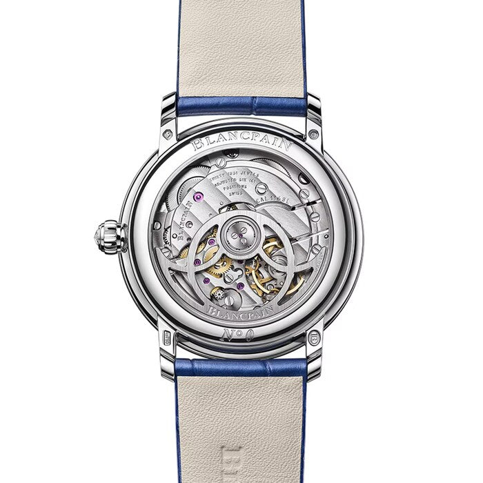 Silver-tone women's watch with visible skeleton dial showing mechanical movement, blue and cream leather strap.
