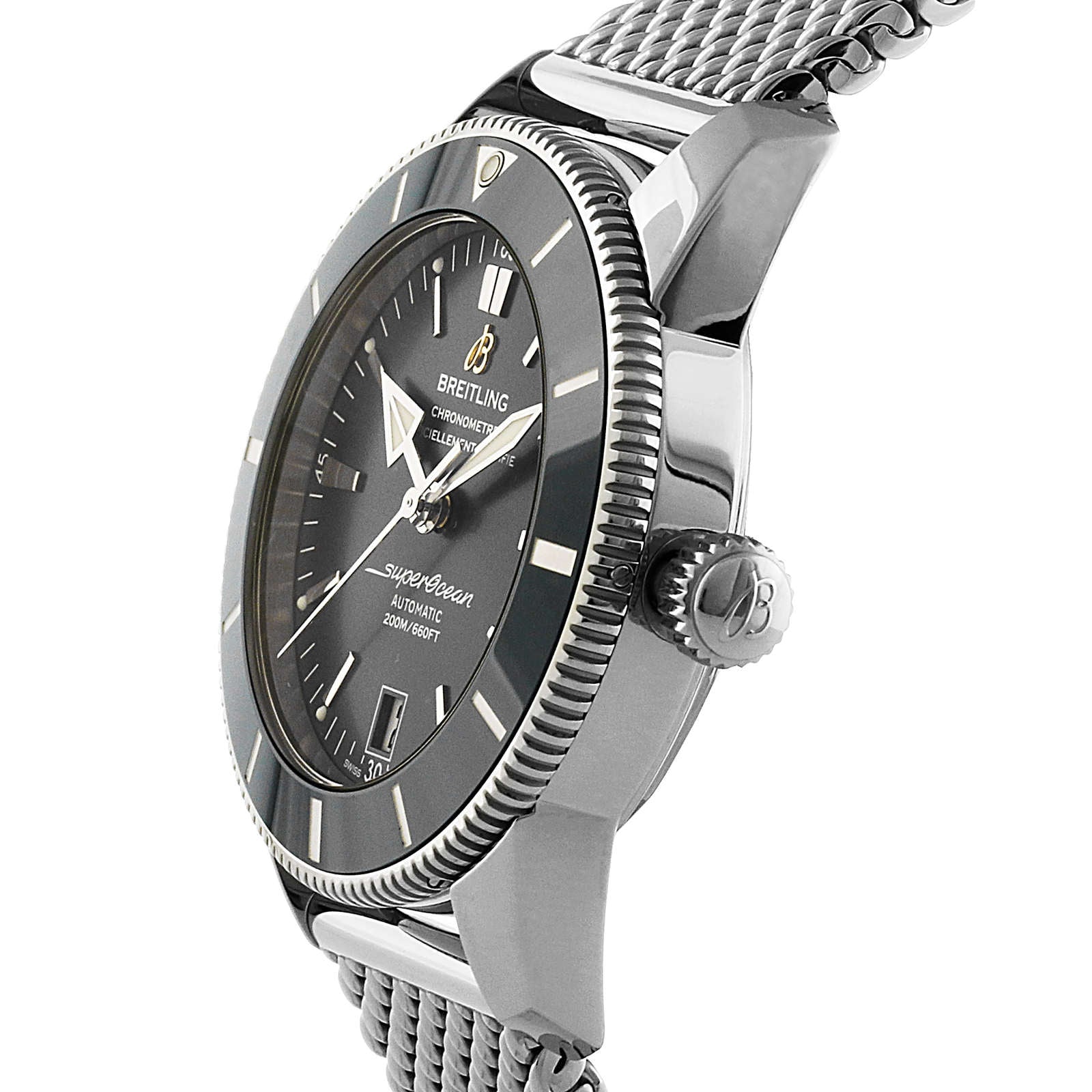 A close-up side view of the Breitling Superocean Heritage B20 Automatic 42 wristwatch, showcasing its stainless steel mesh band, black dial, and precision automatic movement.
