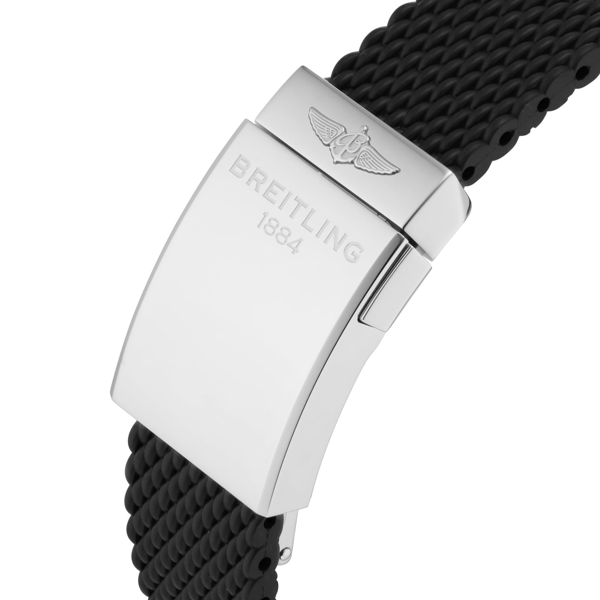Close-up of a Breitling Superocean Heritage B20 Automatic 42 clasp with BREITLING 1884 and winged logo on polished metal, attached to a black textured strap. Features the Breitling B20 movement and water-resistant design.