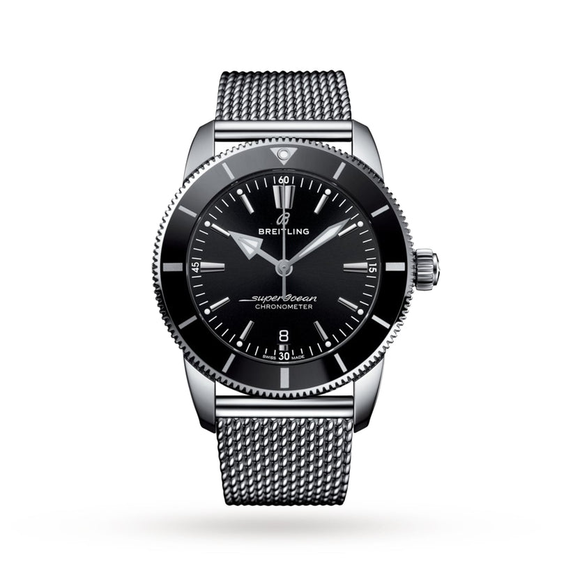 The Breitling Superocean Heritage B20 Automatic 44 features a black dial, silver hour markers, date at 6 o’clock, and a stainless steel mesh bracelet, powered by the Breitling B20 calibre and shown against a white background.