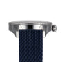 Side view of the Breitling Superocean Heritage B20 Automatic 44 featuring a textured navy blue strap, ridged bezel, and prominent crown and lugs—capturing the elegance of this diver’s watch.