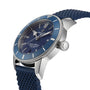 A close-up of the Breitling Superocean Heritage B20 Automatic 44, showcasing its blue dial, silver bezel, blue textured strap, and the precision B20 calibre—capturing the essence of an elegant divers watch.